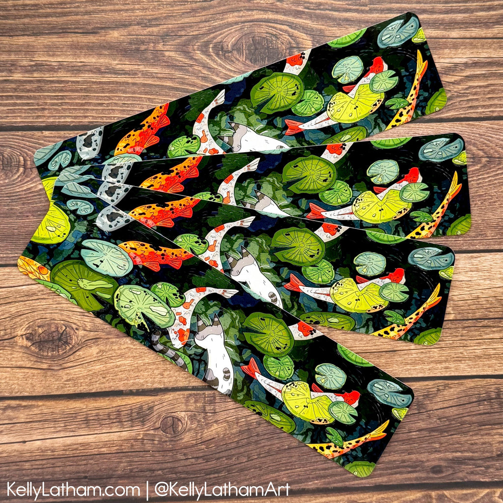 A pair of leggings with a detailed koi fish and lotus pond pattern, laid flat on a rustic wooden background.