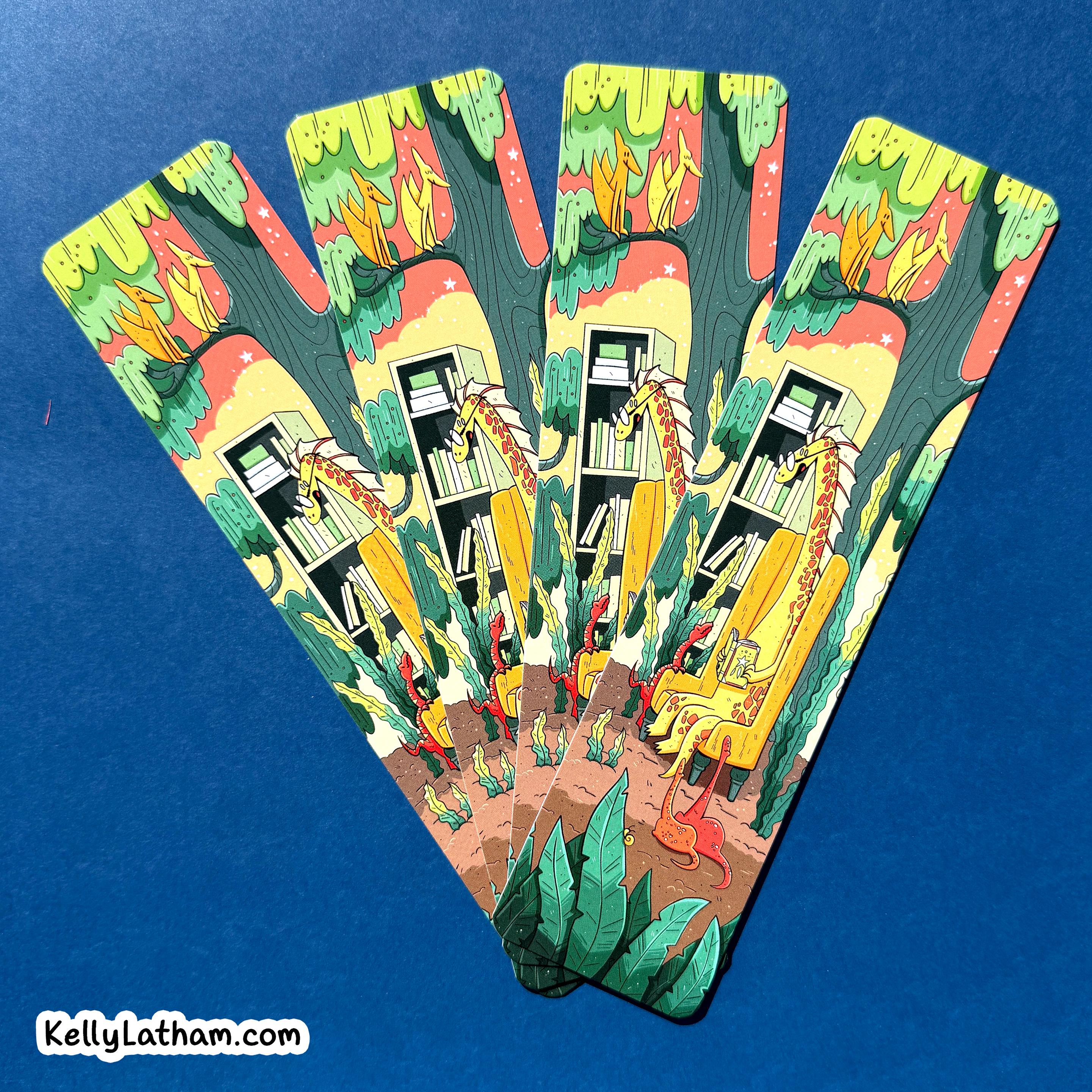 Four illustrated bookmarks fanned out on a solid blue background. The cards feature a whimsical illustration of a yellow dragon reading by a bookshelf in a forest with green trees and red sky.