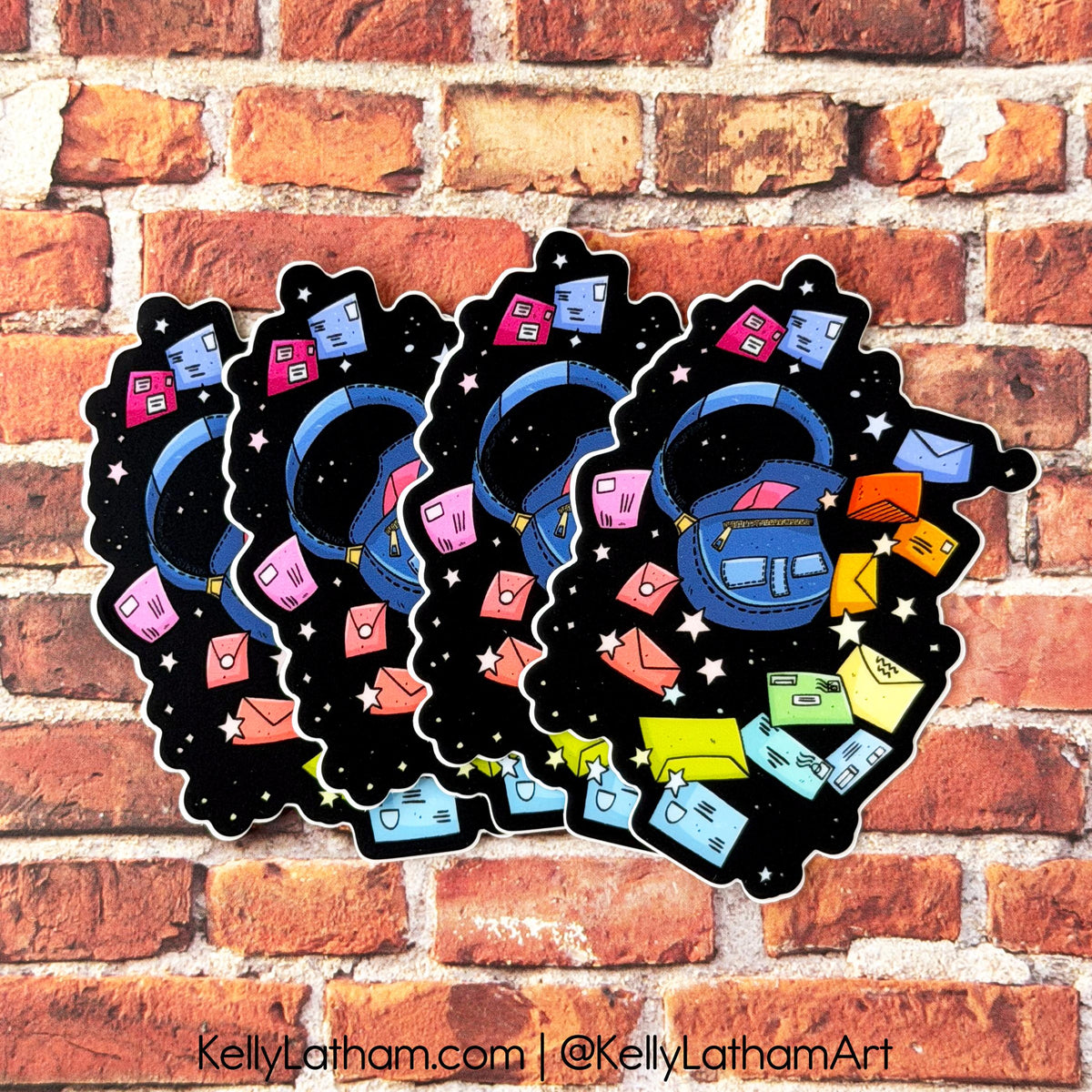 Four overlapping die-cut stickers featuring a whimsical illustration of a blue mailbox in a starry black space, surrounded by colorful mail envelopes, displayed against a red brick wall background.