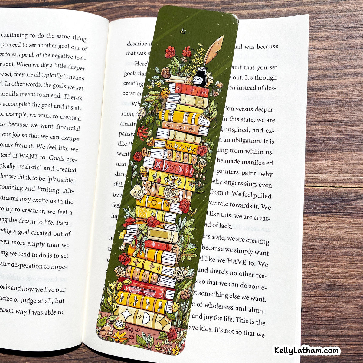 A green book divider with a colorful illustration of a librarian holding a stack of books, placed on an open book.