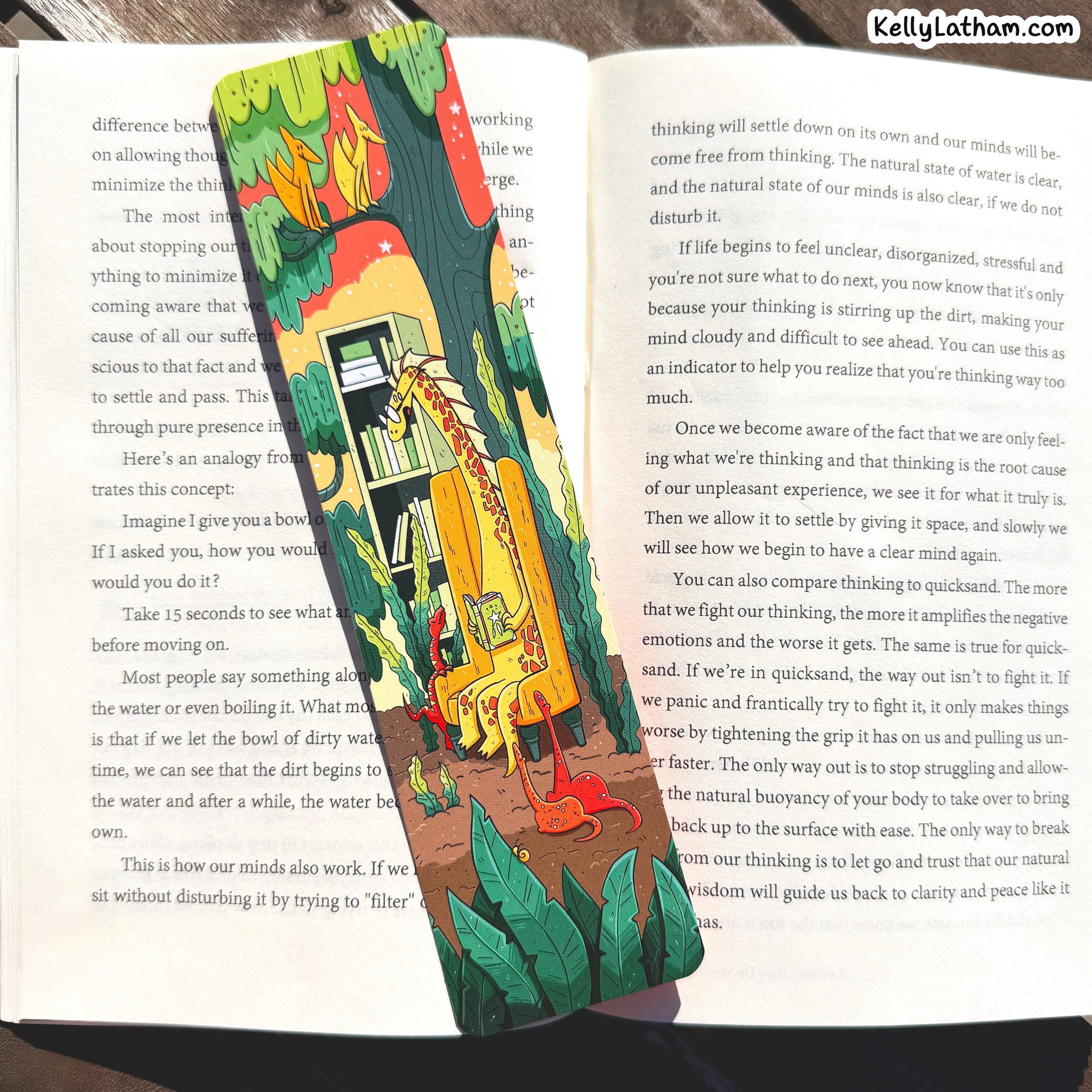 An open book spread with printed text on both pages and a colorful illustration of a skateboarder in a red, yellow, and green outfit riding a skateboard near the center. The name KellyLatham.