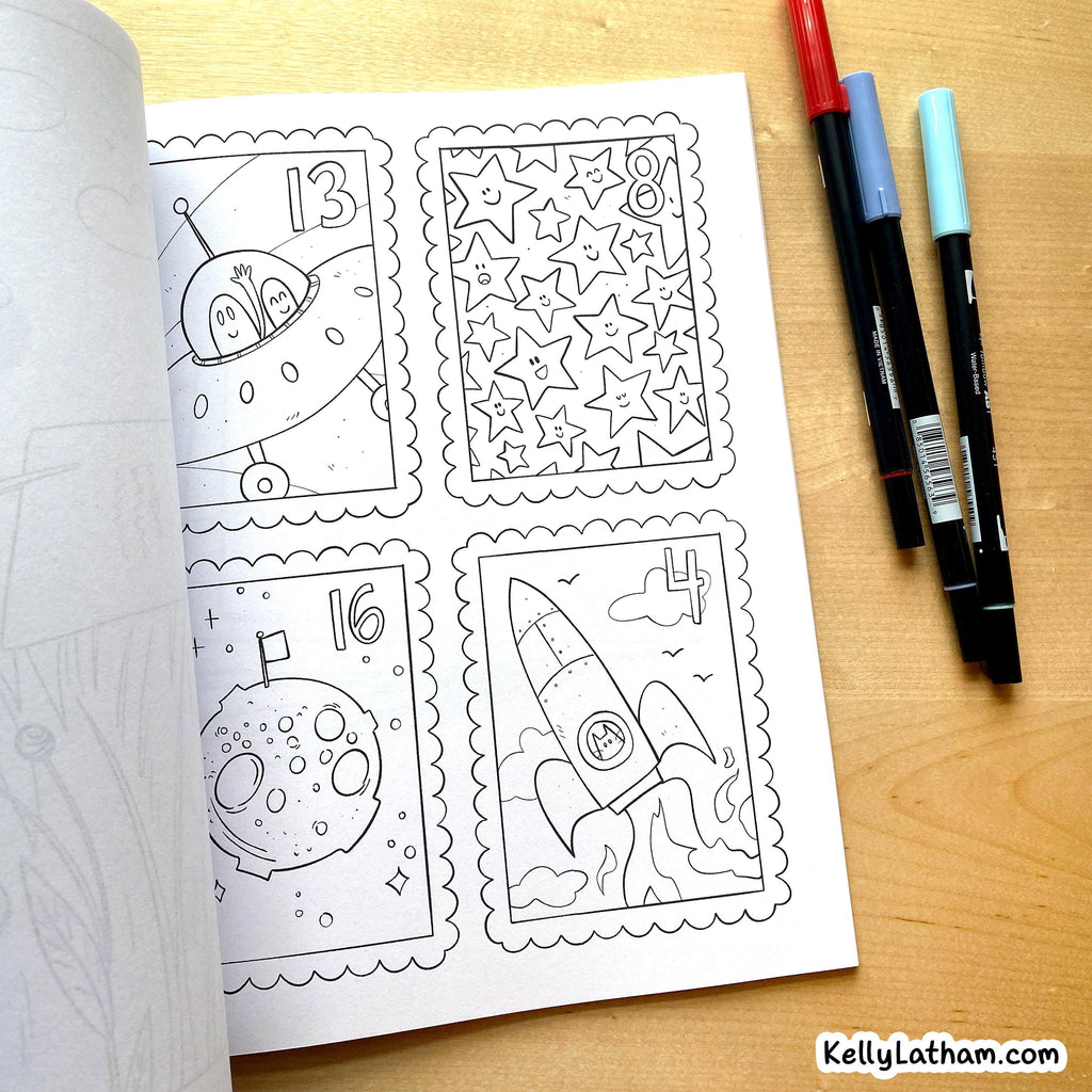 A black-and-white coloring page with four postage-stamp-style panels showing a spaceship, stars, a moon, and a rocket, placed on a wooden surface with three markers beside it.