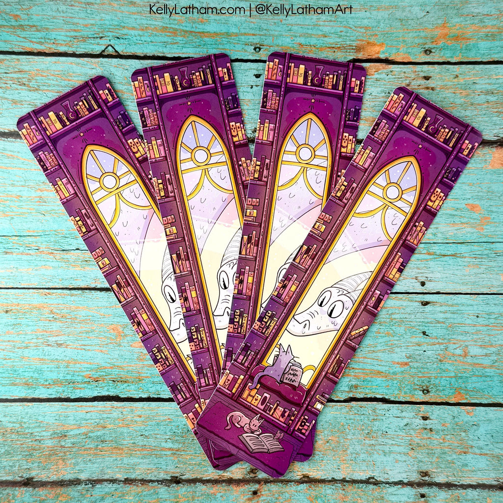 Set of purple bookmarks with stained glass design on a wooden surface