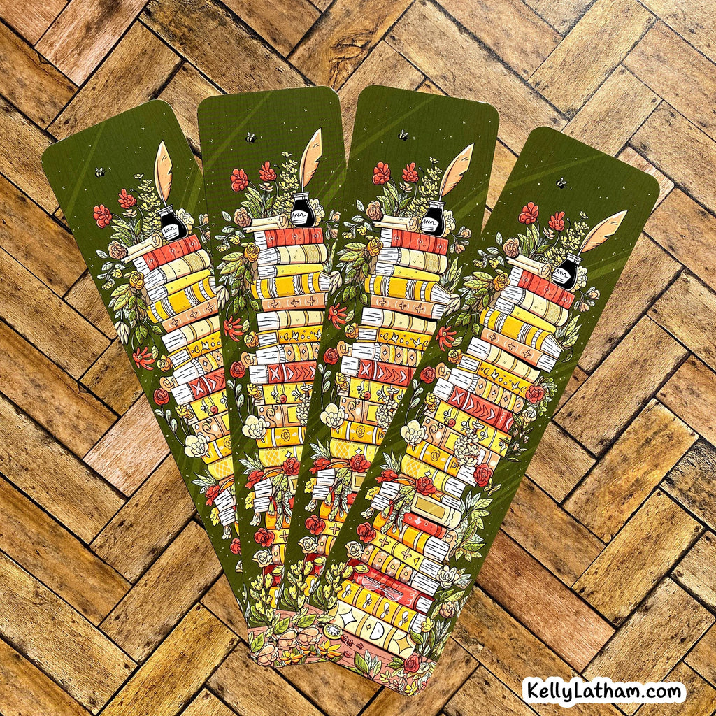 Four identical decorative bookmarks with rabbit illustrations and books on a wooden surface.