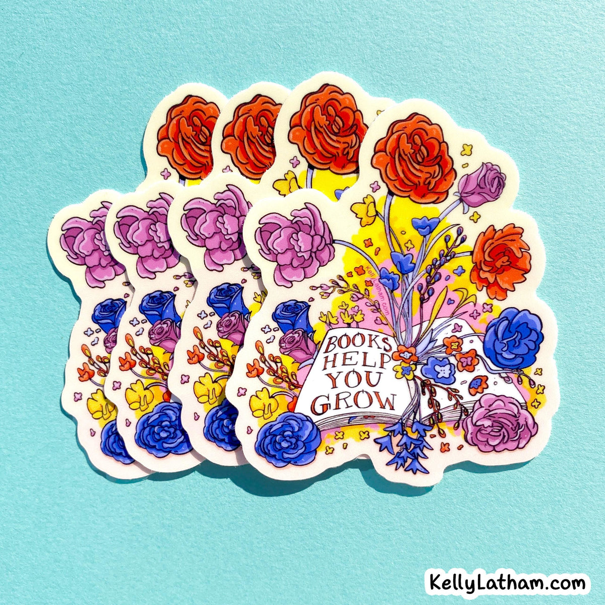 A fan of five illustrated stickers on a light blue background. The stickers feature colorful flowers, including red, purple, blue, and yellow blossoms, with a central white banner reading 'BOOKS HELP YOU GROW.