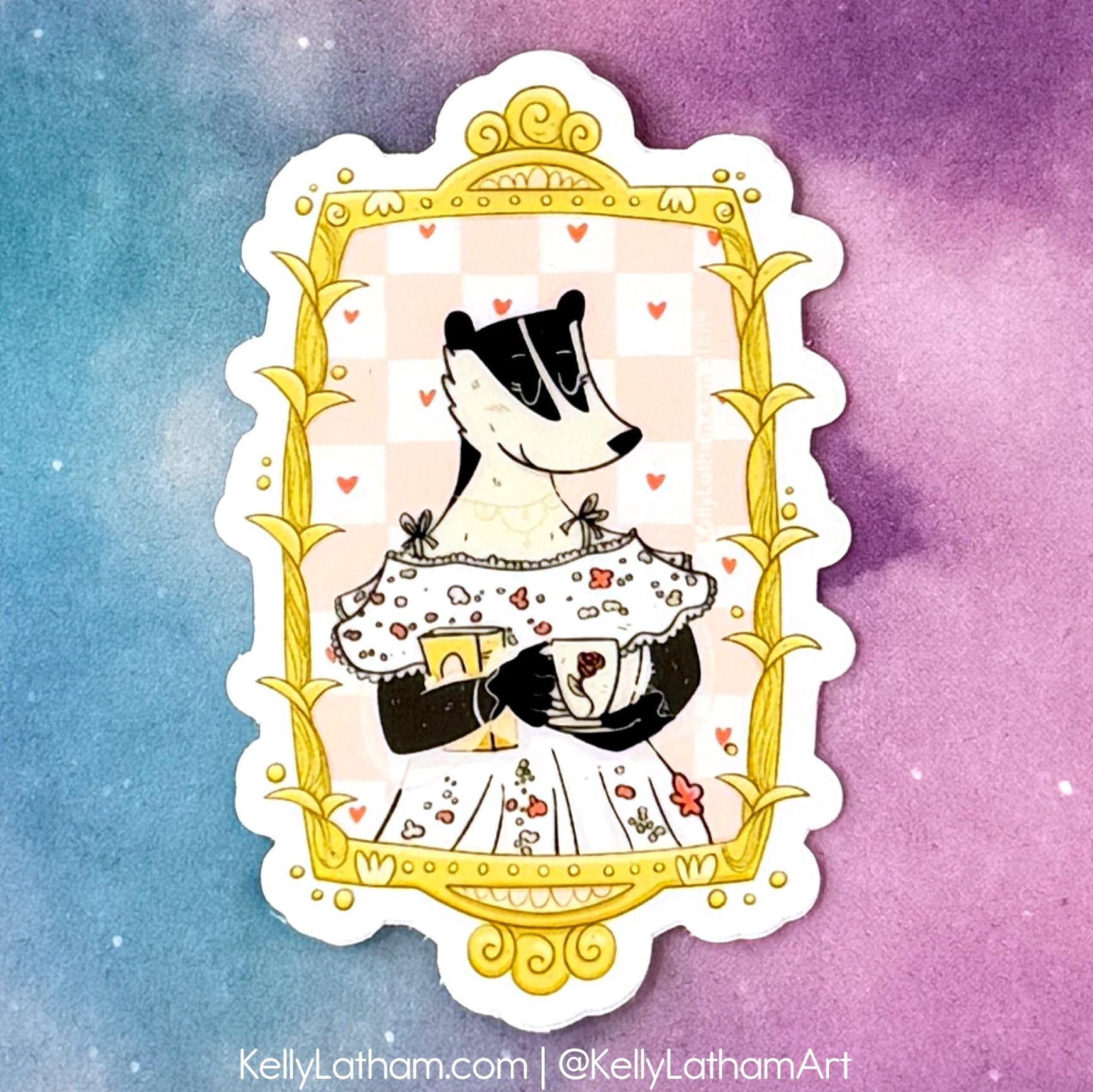 A die-cut sticker featuring an illustration of a badger in a floral dress framed by a gold ornate border, shown against a pastel blue and purple gradient background.