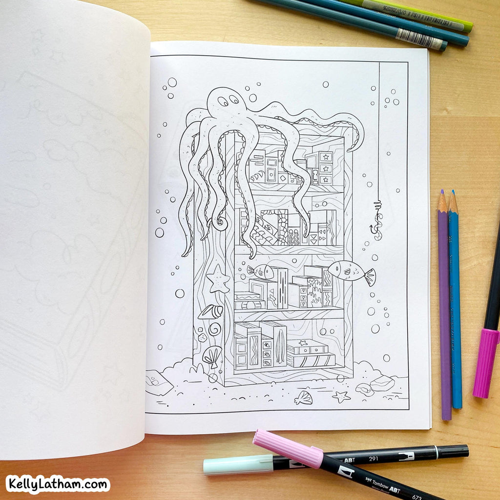 An open coloring book or art journal on a wooden desk, showing a black-and-white underwater scene page with an octopus, fish, bubbles, and a house. Colored pencils and markers are placed around it, and the watermark KellyLatham.