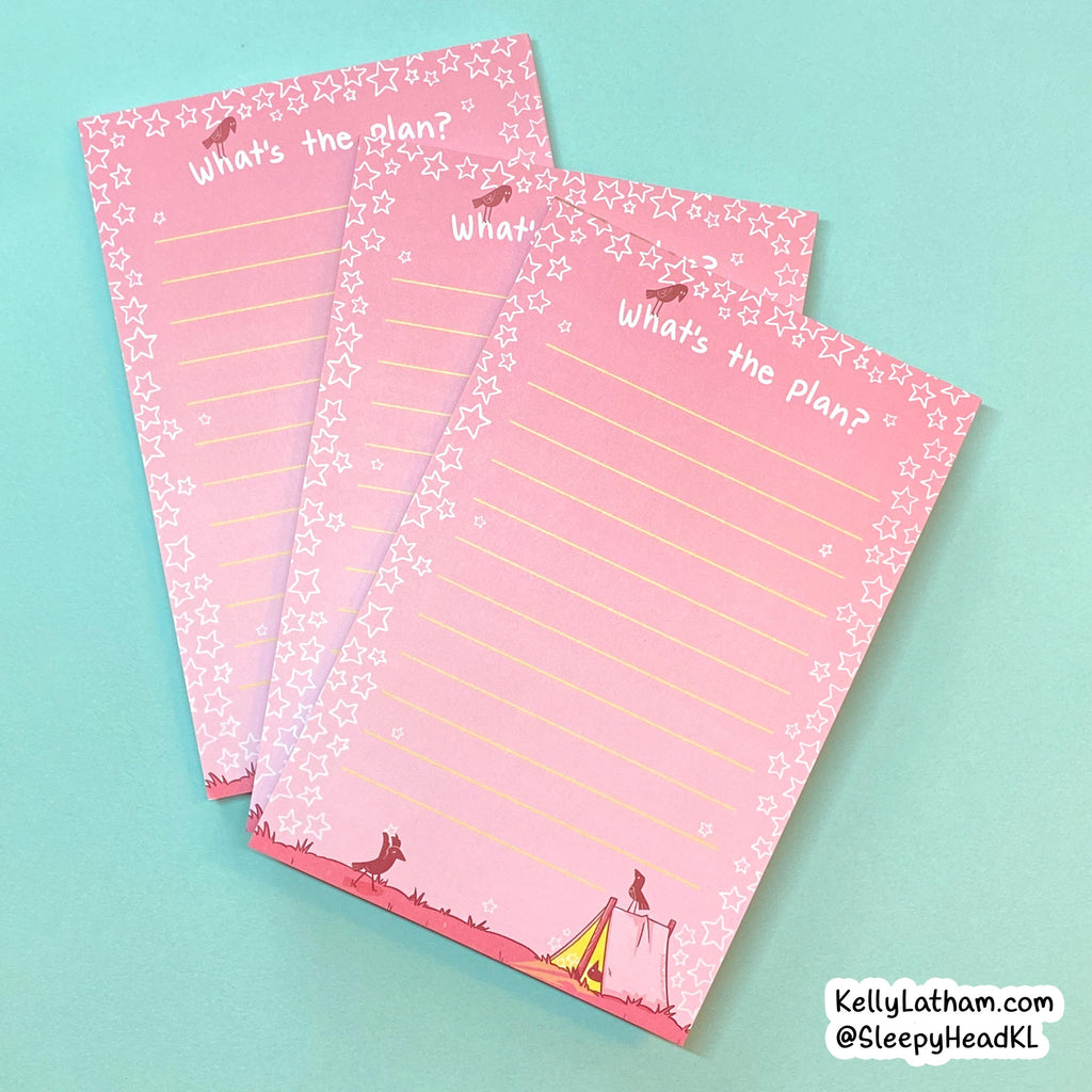 Three pink lined notepads with a star border and circus-themed illustrations, arranged on a light blue background. The notepads feature the text 'What's the plan?' and a small watermark in the bottom right corner reading 'KellyLatham.