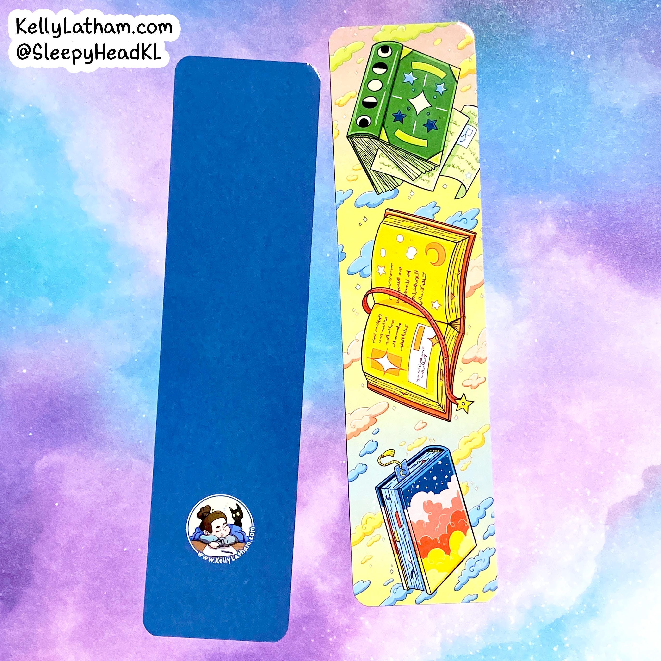 Two rectangular sleep aids or mats shown on a pastel cloud-like background. The left item is solid blue with a small circular cartoon logo near the bottom.