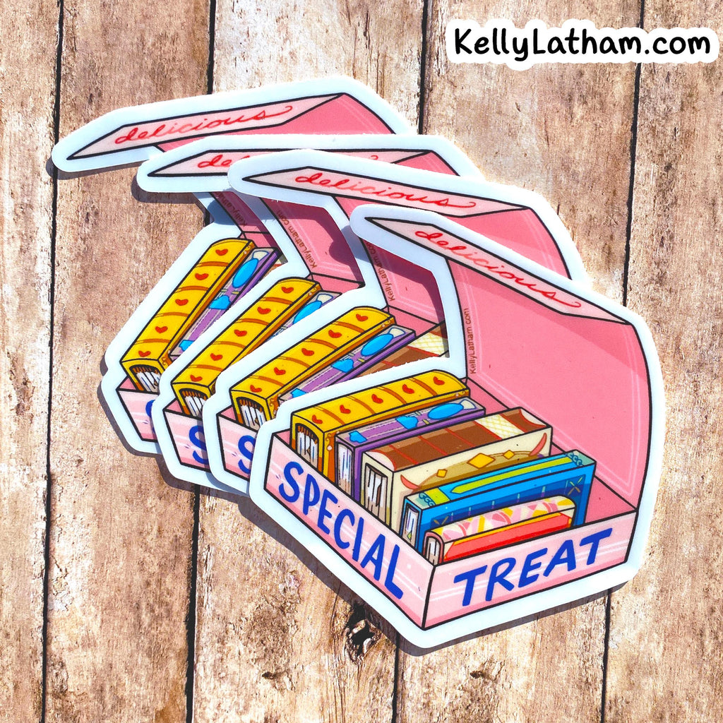 A set of illustrated die-cut stickers shaped like an open pink candy box labeled 'SPECIAL TREAT,' filled with colorful candy bars, displayed on a rustic wood plank background. The brand text 'KellyLatham.