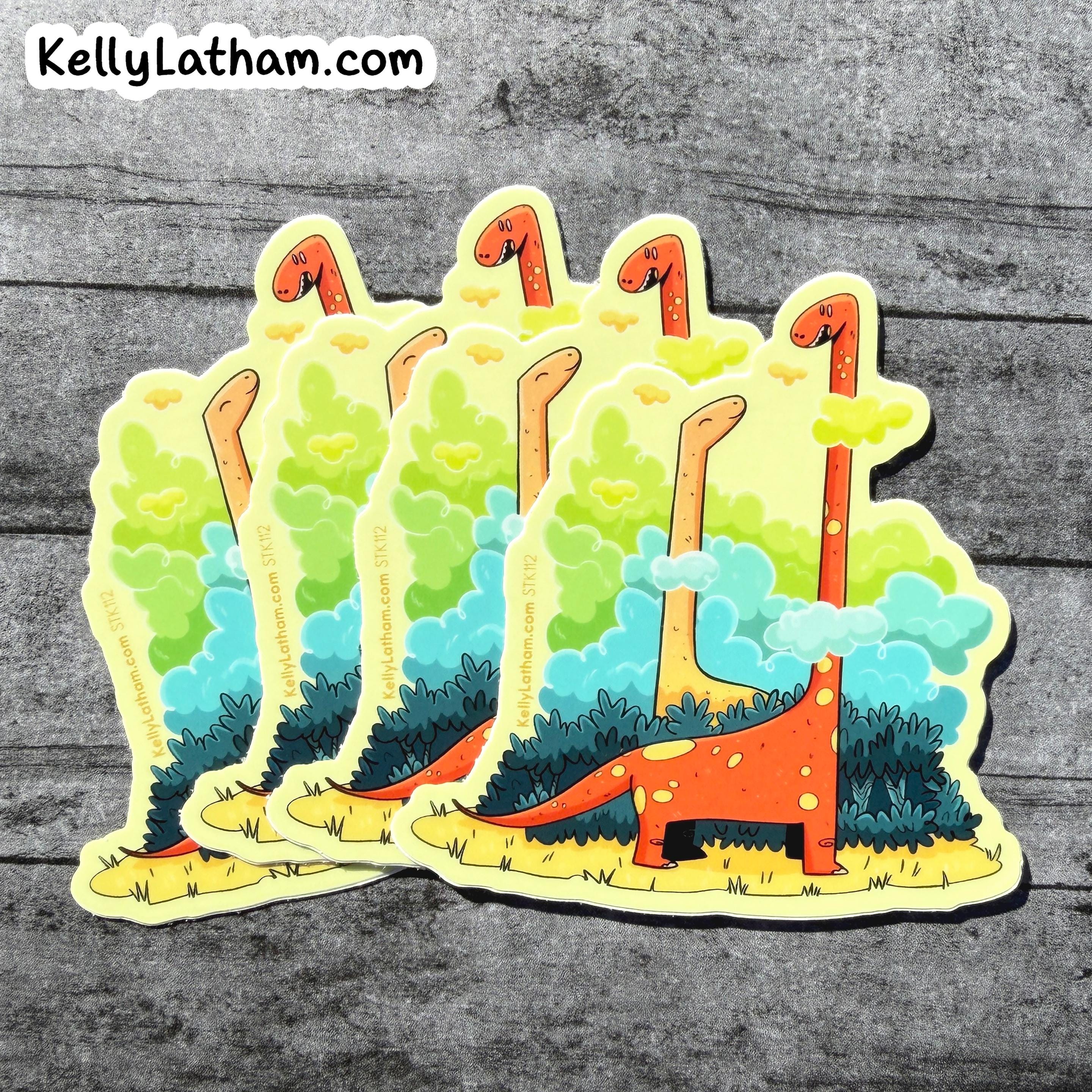 Five die-cut stickers featuring a whimsical long-necked dinosaur landscape, arranged in a fan shape on a gray wood-textured background. The sticker design includes an orange dinosaur with yellow spots, green trees, blue clouds, and yellow grass, with the text 'KellyLatham.