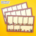 Three weekly planner notepads with a rustic wood-grain border and colorful book illustrations on a bright yellow background. A brand watermark in the top left corner reads 'KellyLatham.