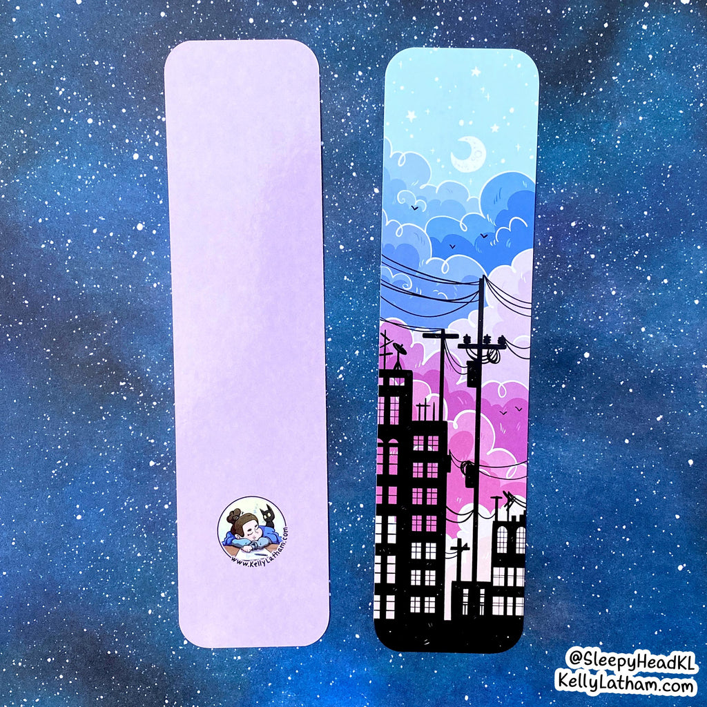 Two rectangular bookmarks or tabs shown against a starry blue space background. The left item is a plain light lavender/periwinkle card with a small circular cartoon logo near the bottom.