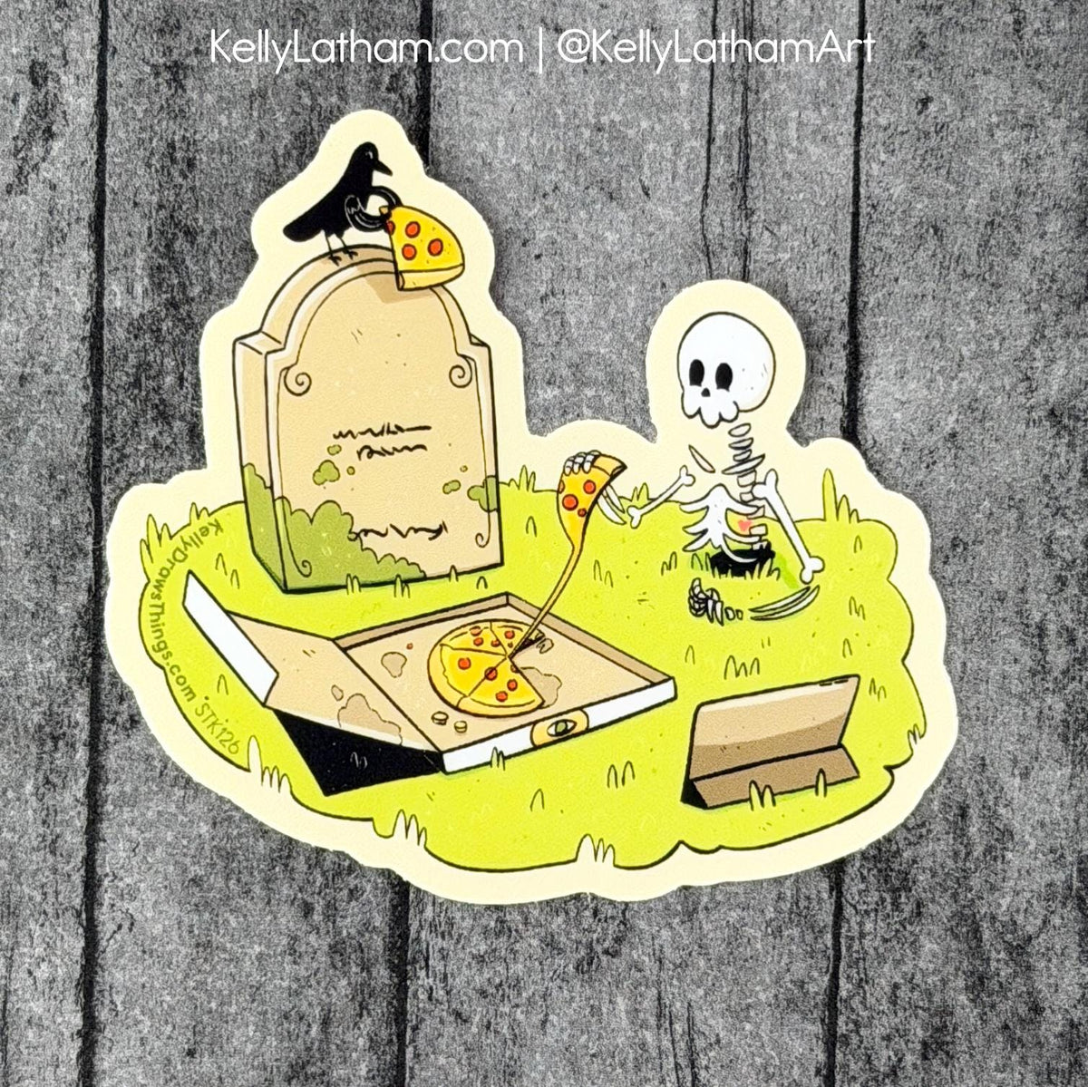 A die-cut sticker featuring a cartoon graveyard scene with a skeleton holding a slice of pizza next to an open pizza box and a tombstone topped with a crow and a slice of pizza, shown on a gray wood plank background.