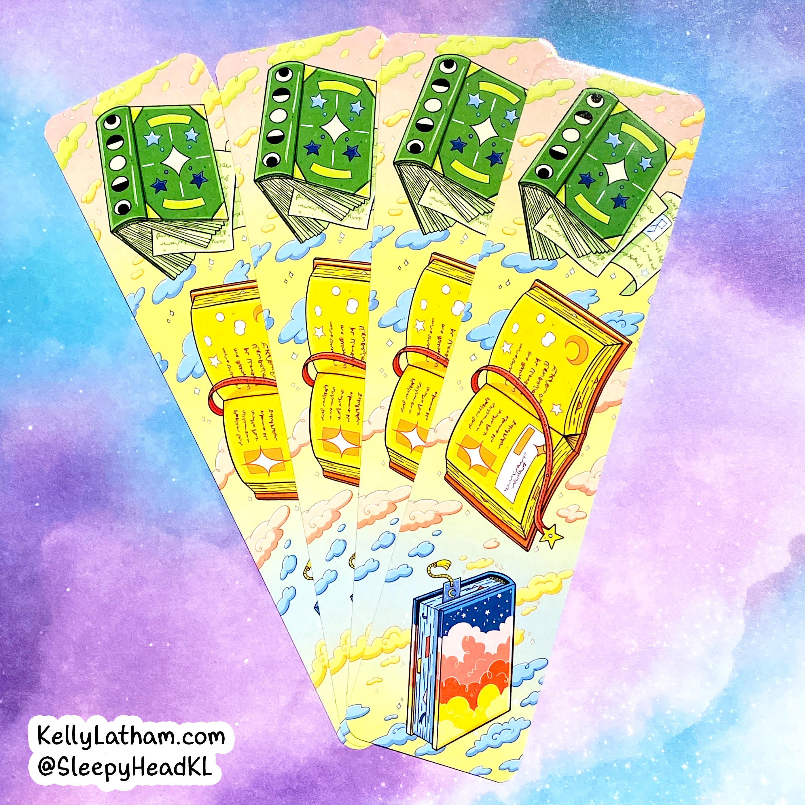 A fan-shaped arrangement of illustrated tarot cards or oracle cards on a pastel purple and blue cloud-like background. The cards include green money-card designs, yellow ticket-like cards, and a blue card with a sunset scene.