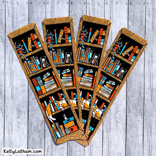 Four decorative bookish bookmarks or tags with a wood-grain border and an illustrated pattern of bookshelves filled with colorful books, arranged on a light gray wood plank background. A small 'KellyLatham.