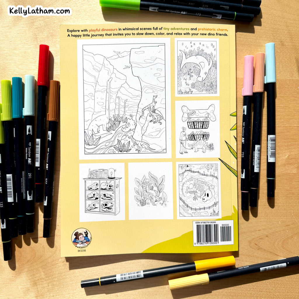 A coloring book shown flat on a light wood surface, surrounded by colorful markers. The back cover of the book features black-and-white line art scenes and animals, with a yellow border.